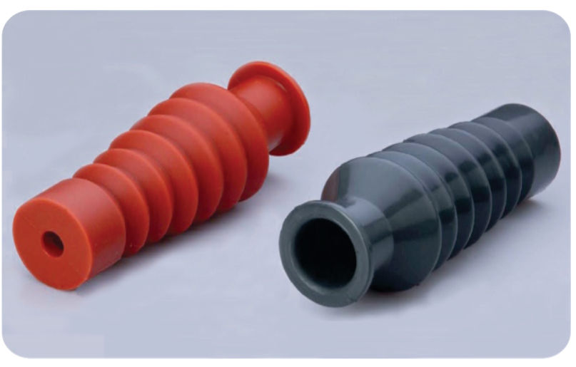 Two straight ribbed BUSHINGBOOT insulating boots, one red and one grey