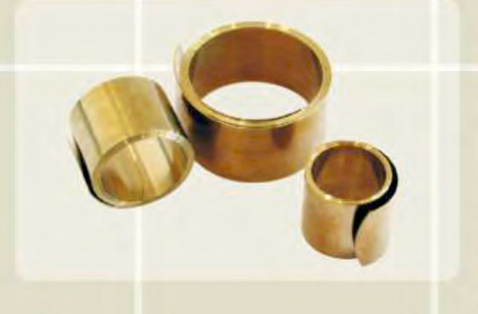 Three coiled constant force springs of different widths used to bond cable screens to earthing