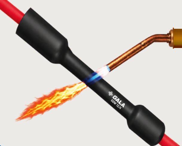 Black GDW dual wall tube being shrunk with a gas torch over a red cable, the middle section recovered and both ends still expanded