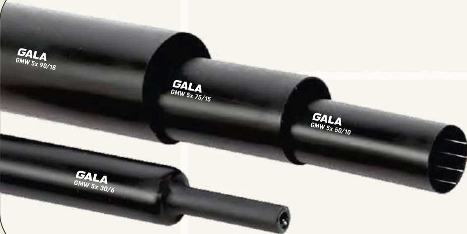 Black GMW 5x high shrink ratio tubes of three sizes nested inside each other, with a smaller tube shrunk down at one end
