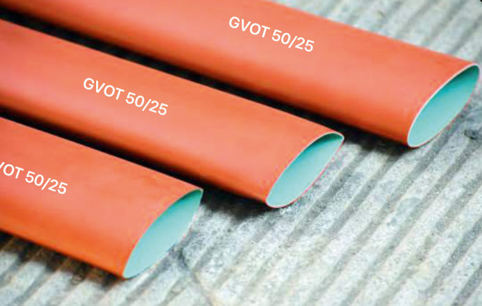 Three orange-red GVOT 50/25 stress control tubes with their pale turquoise inner layer visible at the cut ends