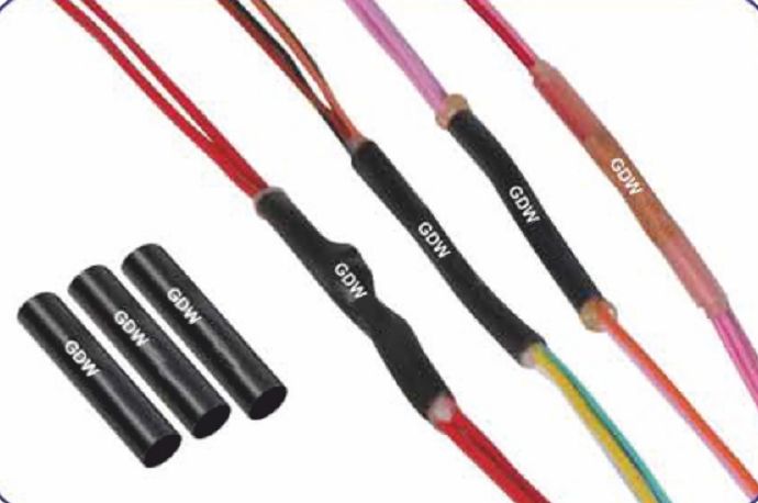 Three loose GDW dual wall tubes beside wire harness splices sealed with shrunk GDW tubes